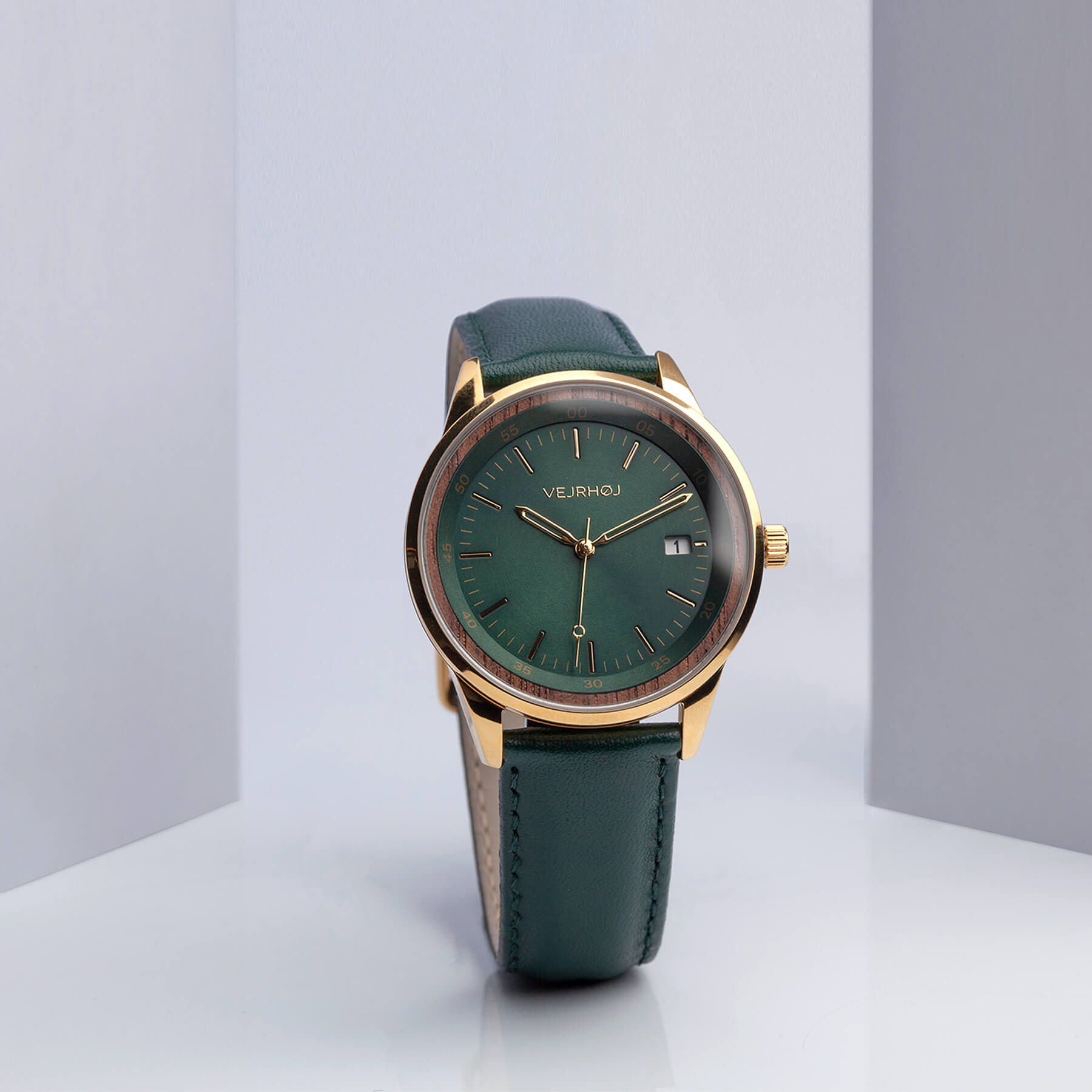 Automatic green and gold watch