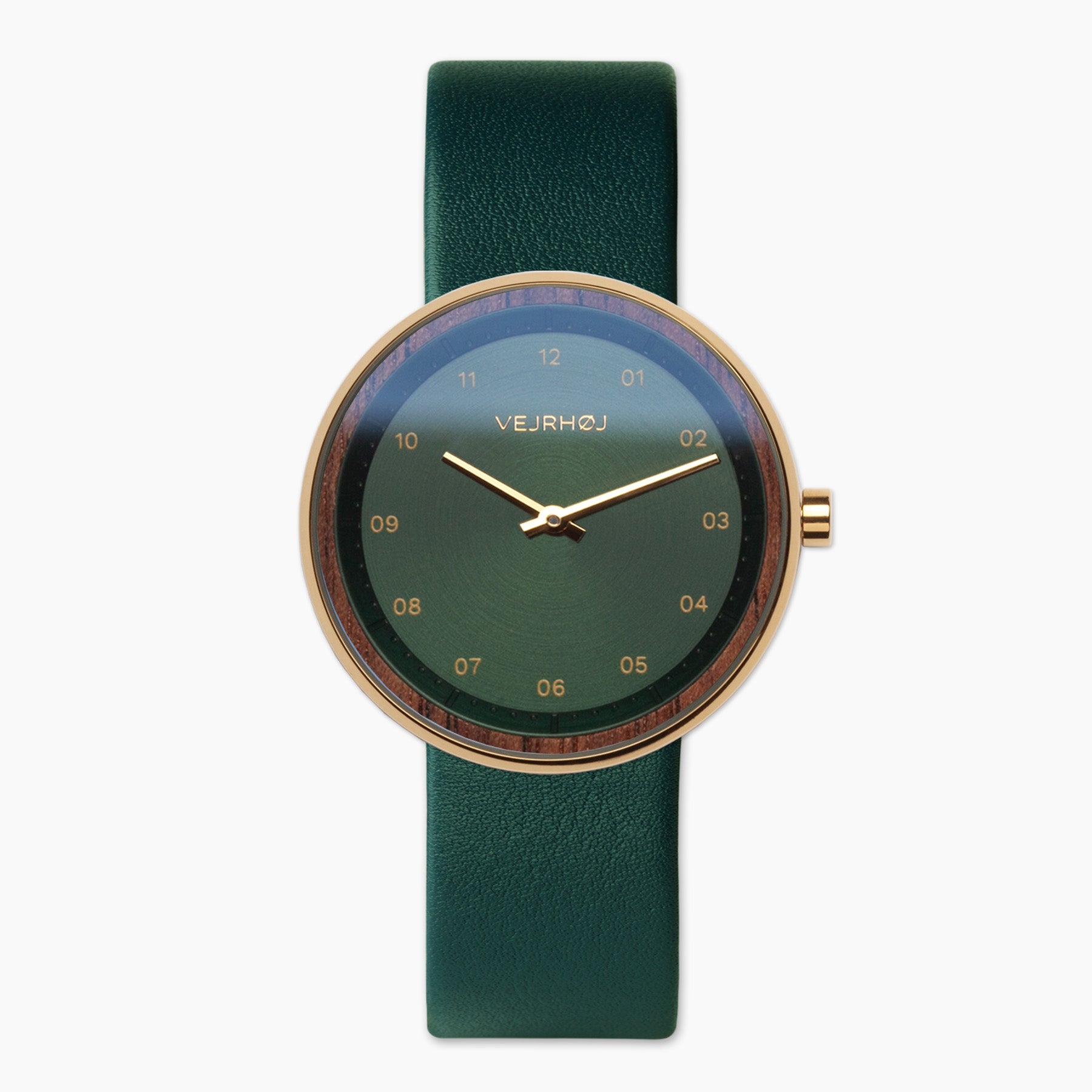 EMERALD men's watch by Vejrhøj, with green stainless steel dial and gold hands. The fusion of Walnut wood and metal makes it wearable for any occasion.
