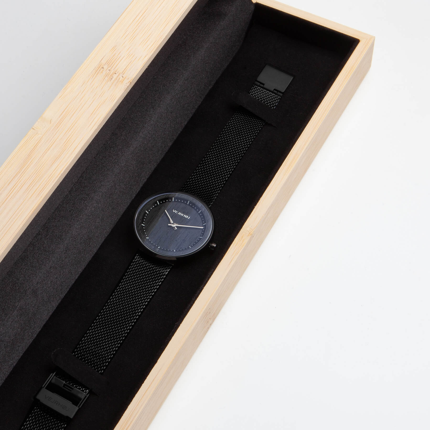 Black watch with mesh band inside bamboo box