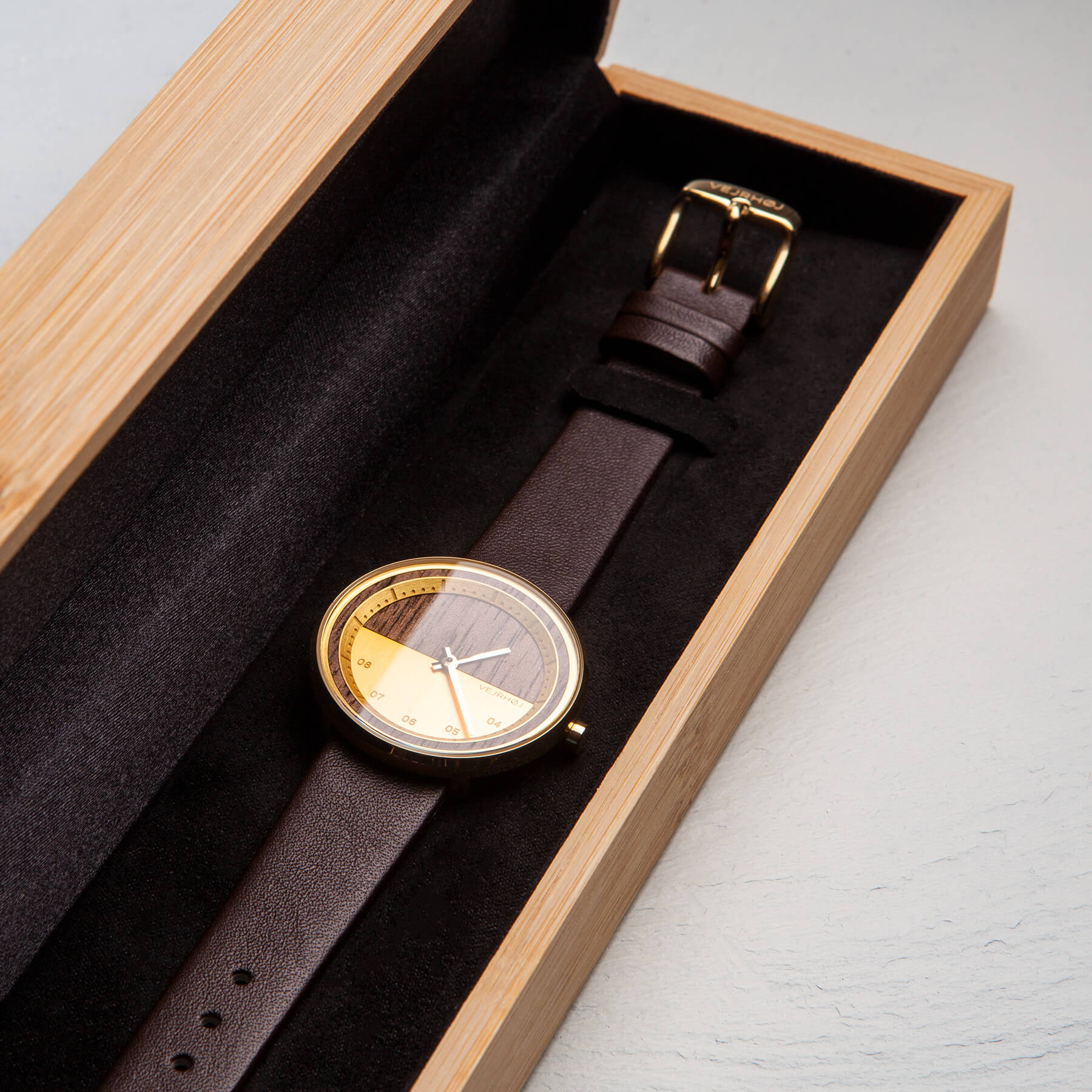 Gold and wood watch for women in a wooden box