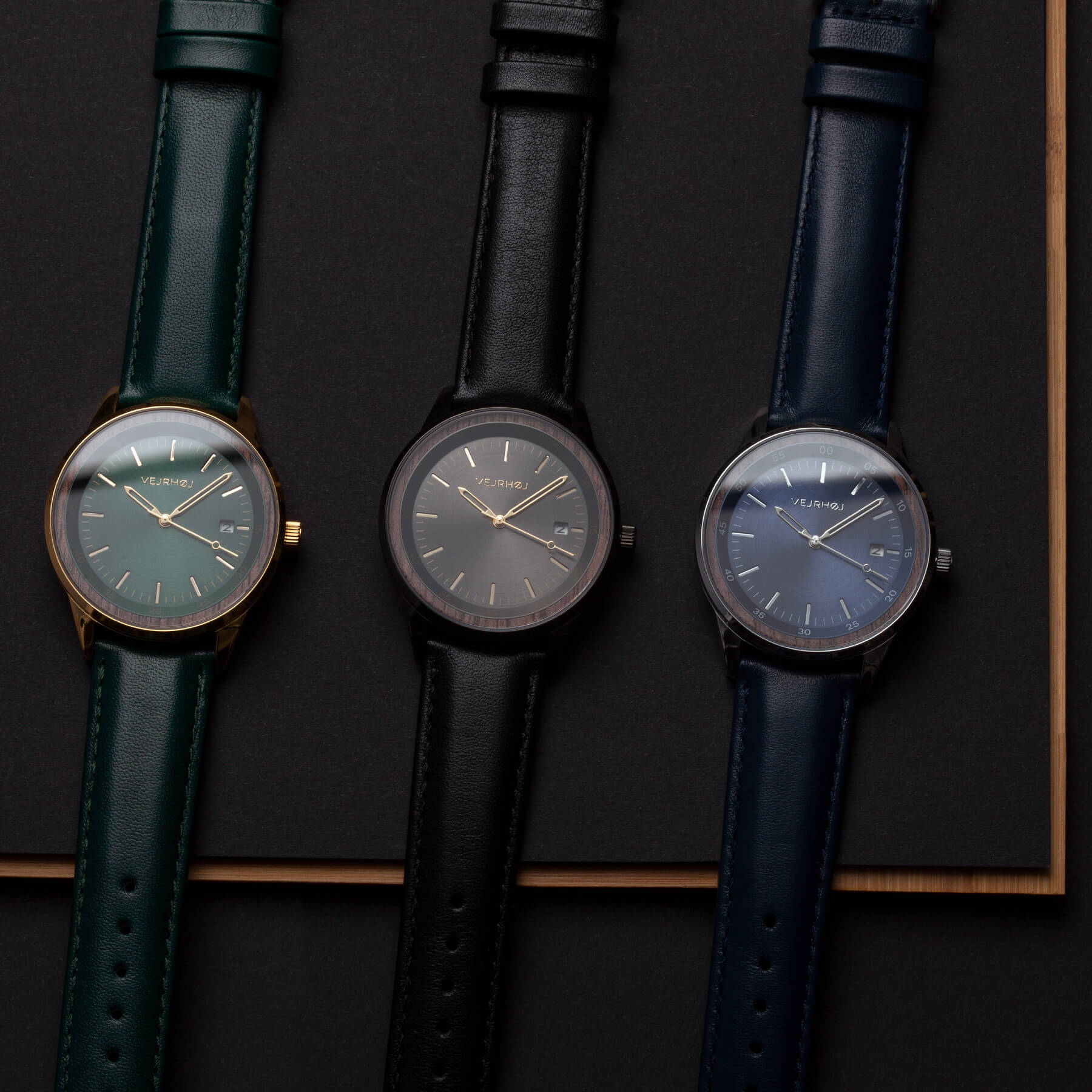 simple automatic watches in black, blue and green with wooden parts