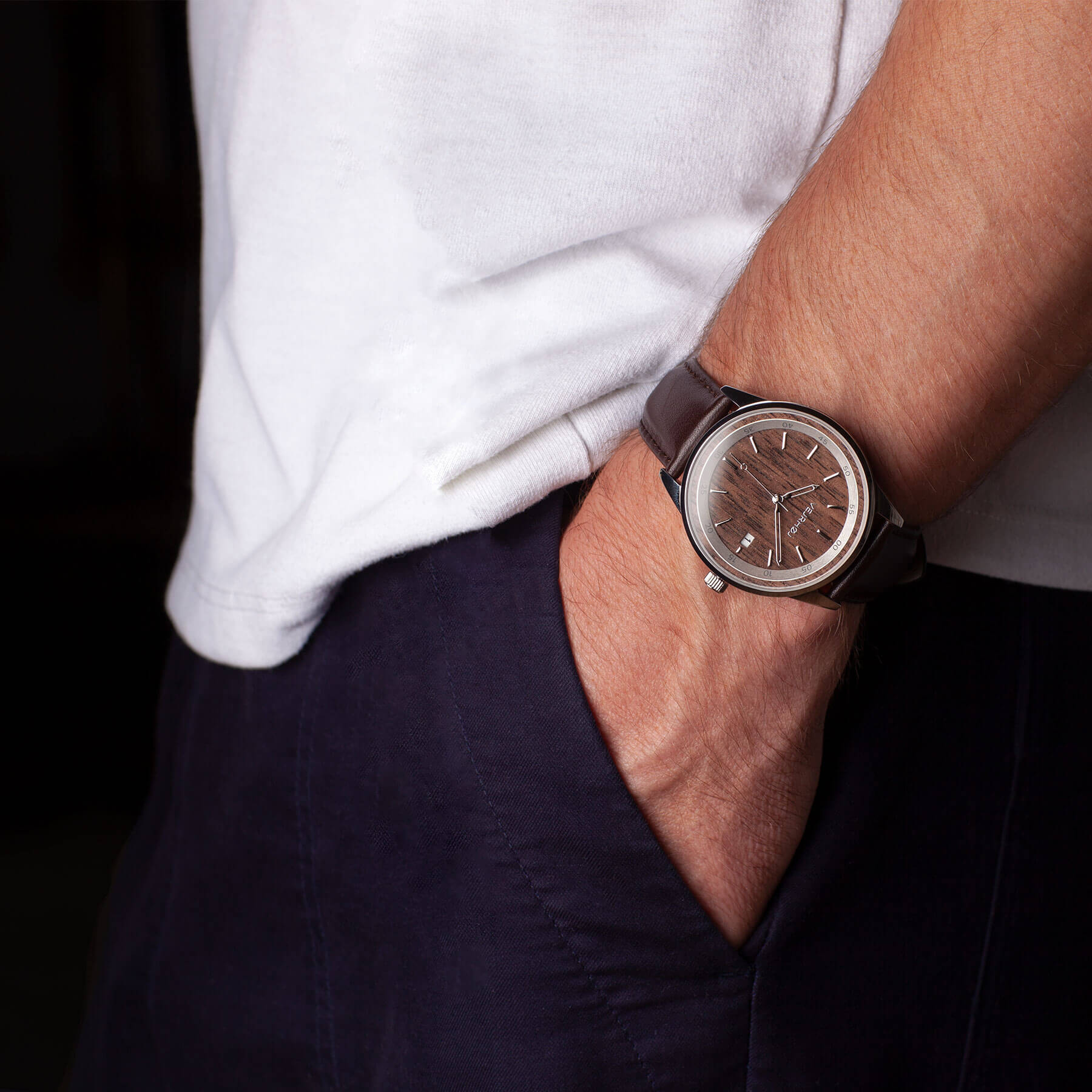 automatic brown watch with brown straps being worn on the wrist