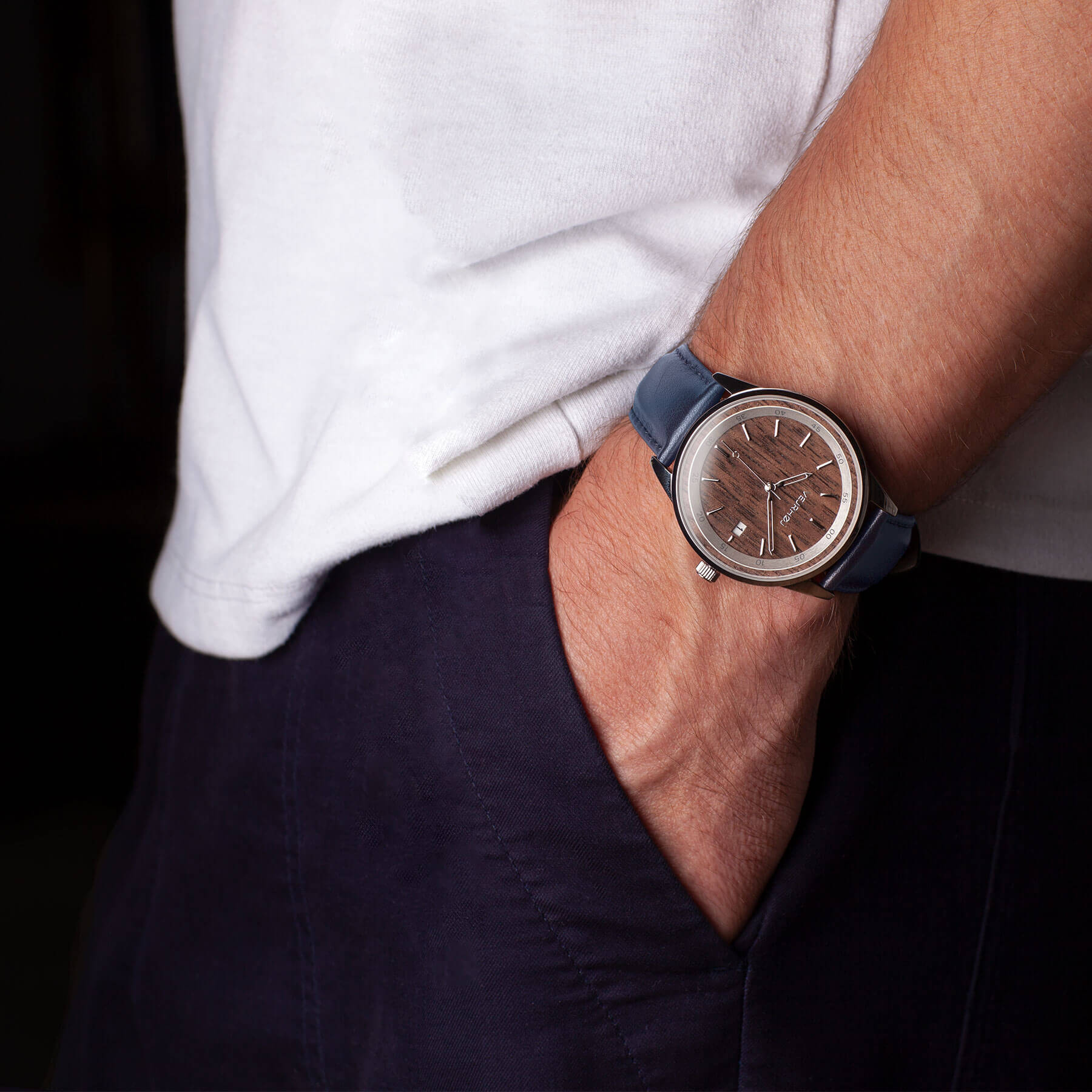 blue strapped brown automatic wrist watch being worn 