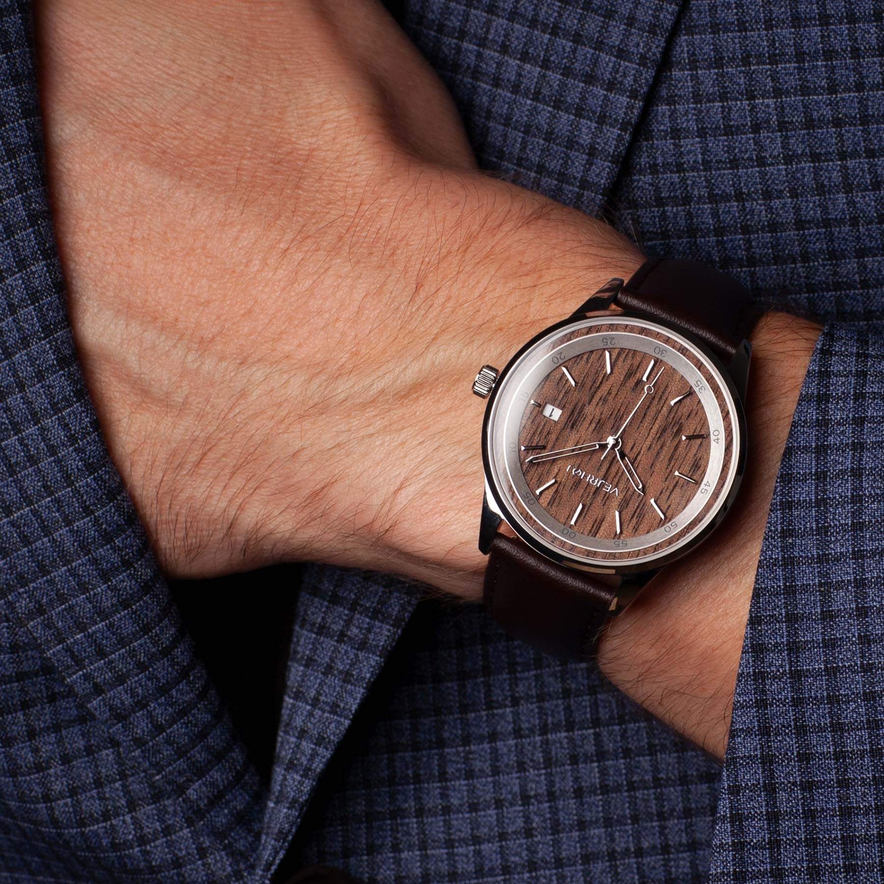 Automatic wrist watch with a dial made of natural walnut wood with brown straps paired with a suit