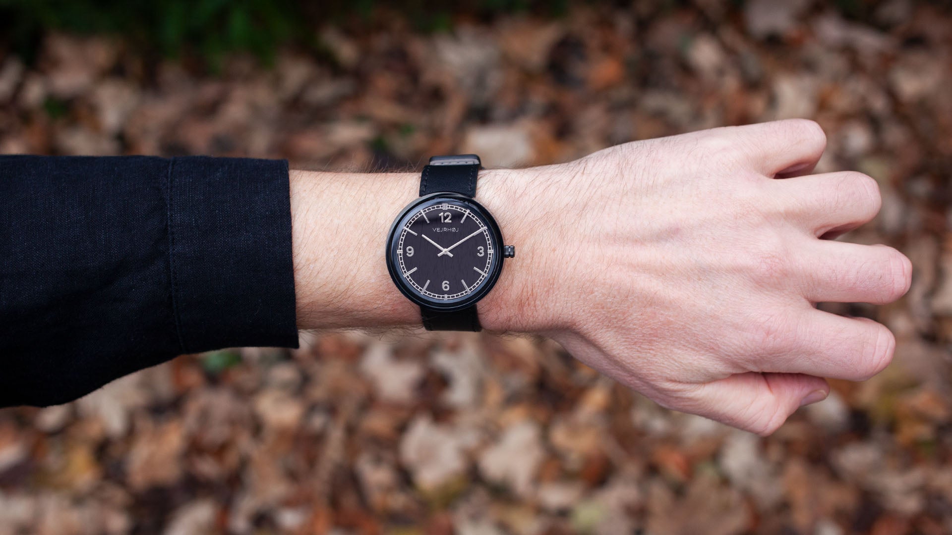 Black and silver elegant watch with numbers on hand from VEJRHØJ