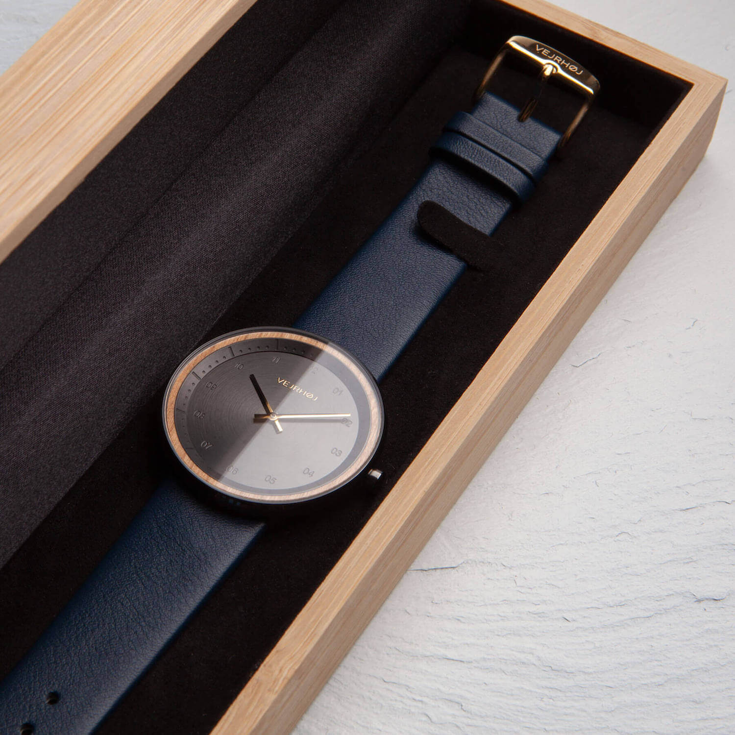 Nordic black watch with a blue strap in a wooden box