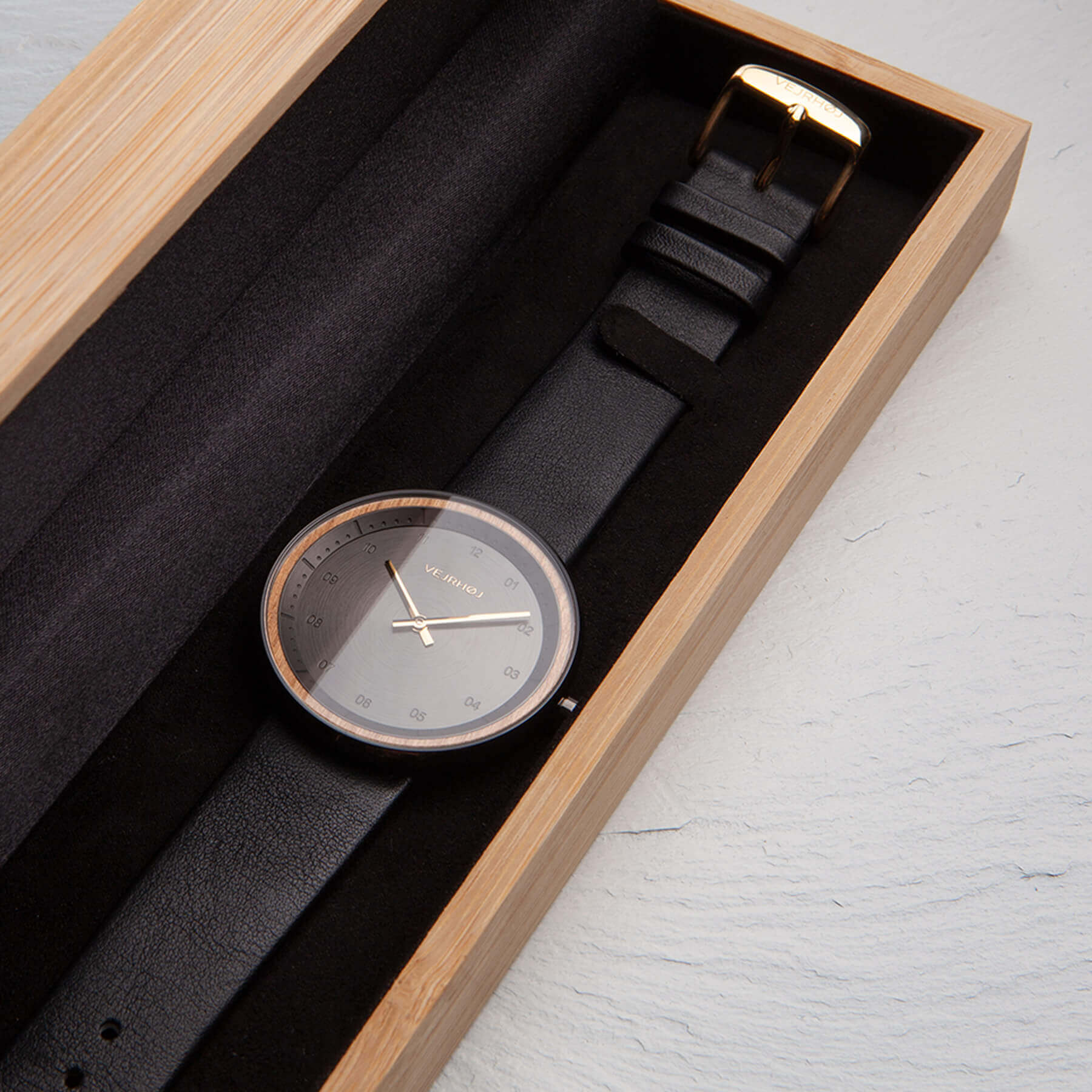 Elegant black watch in wooden box