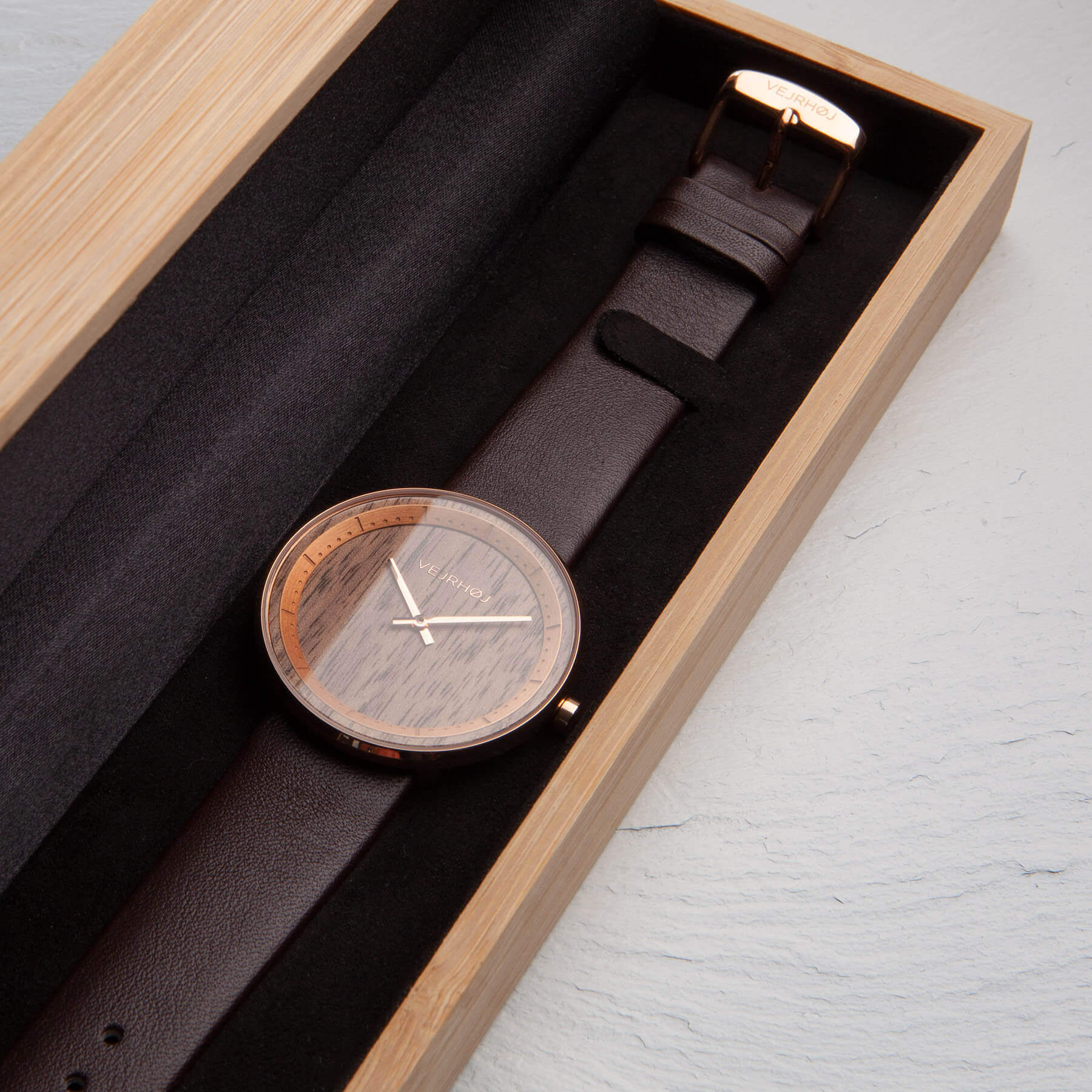 Elegant wood watch with rose gold placed in a wooden box