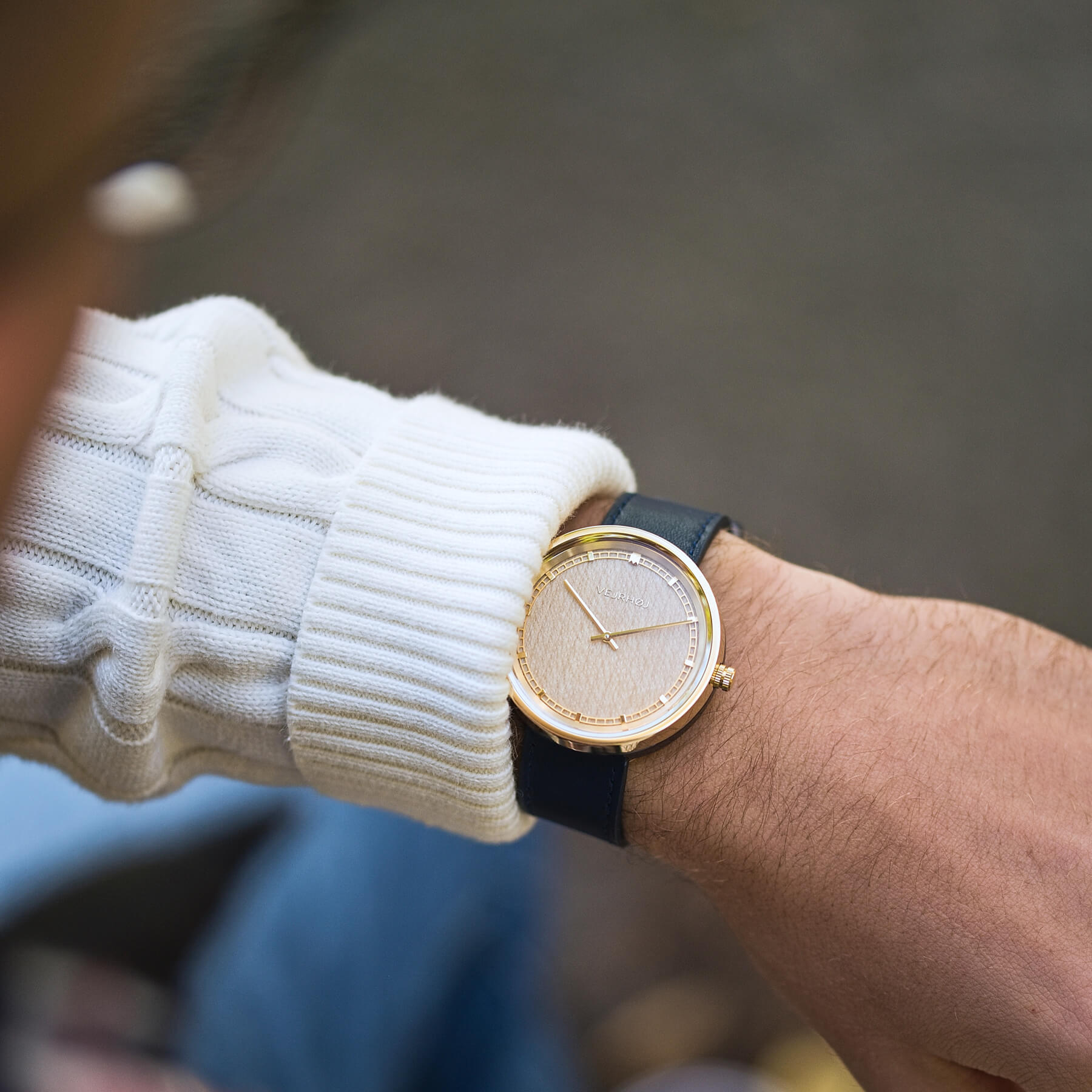 man wearing VEJRHØJ's maple wood watch with white knit sweater