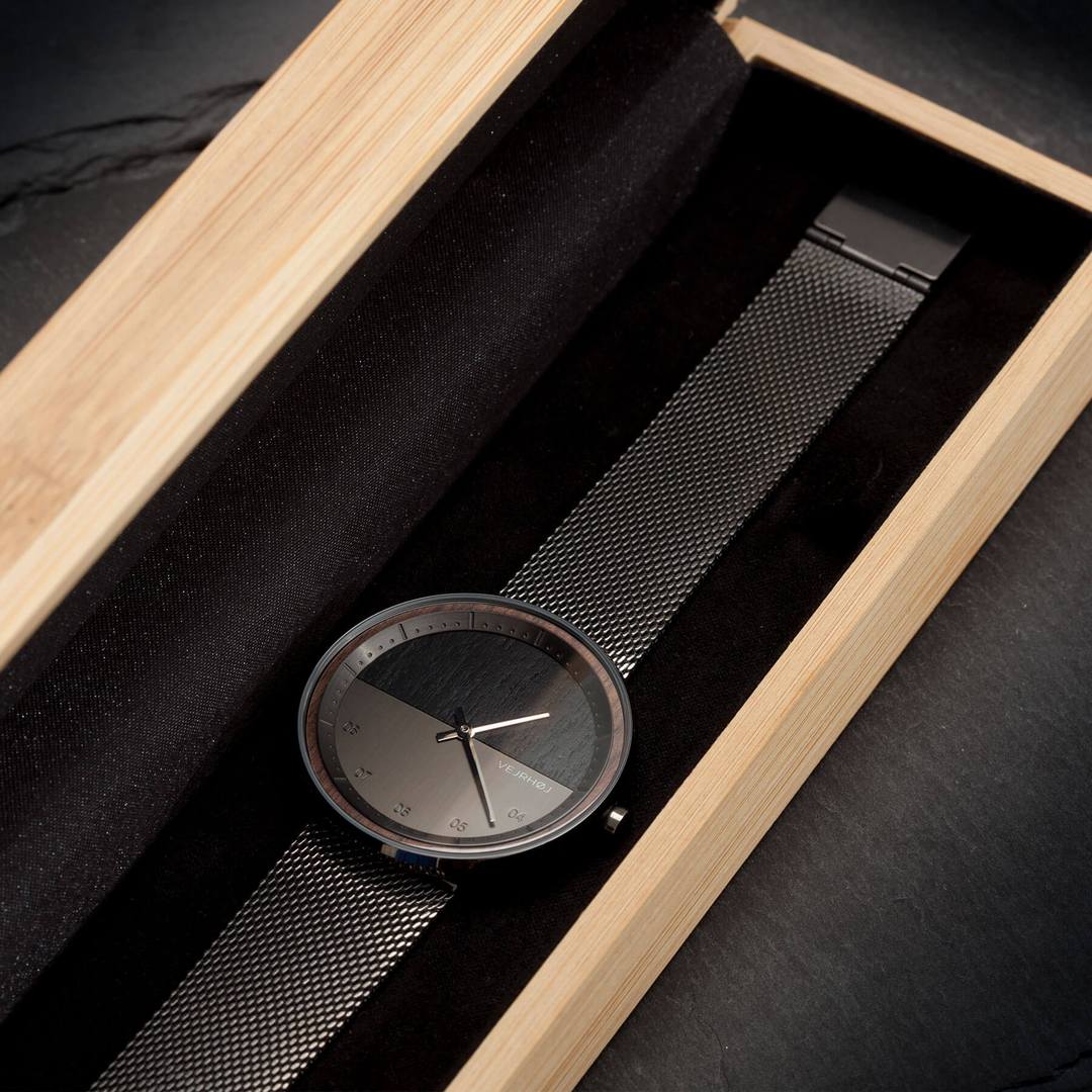 Elegant black watch in a wooden box