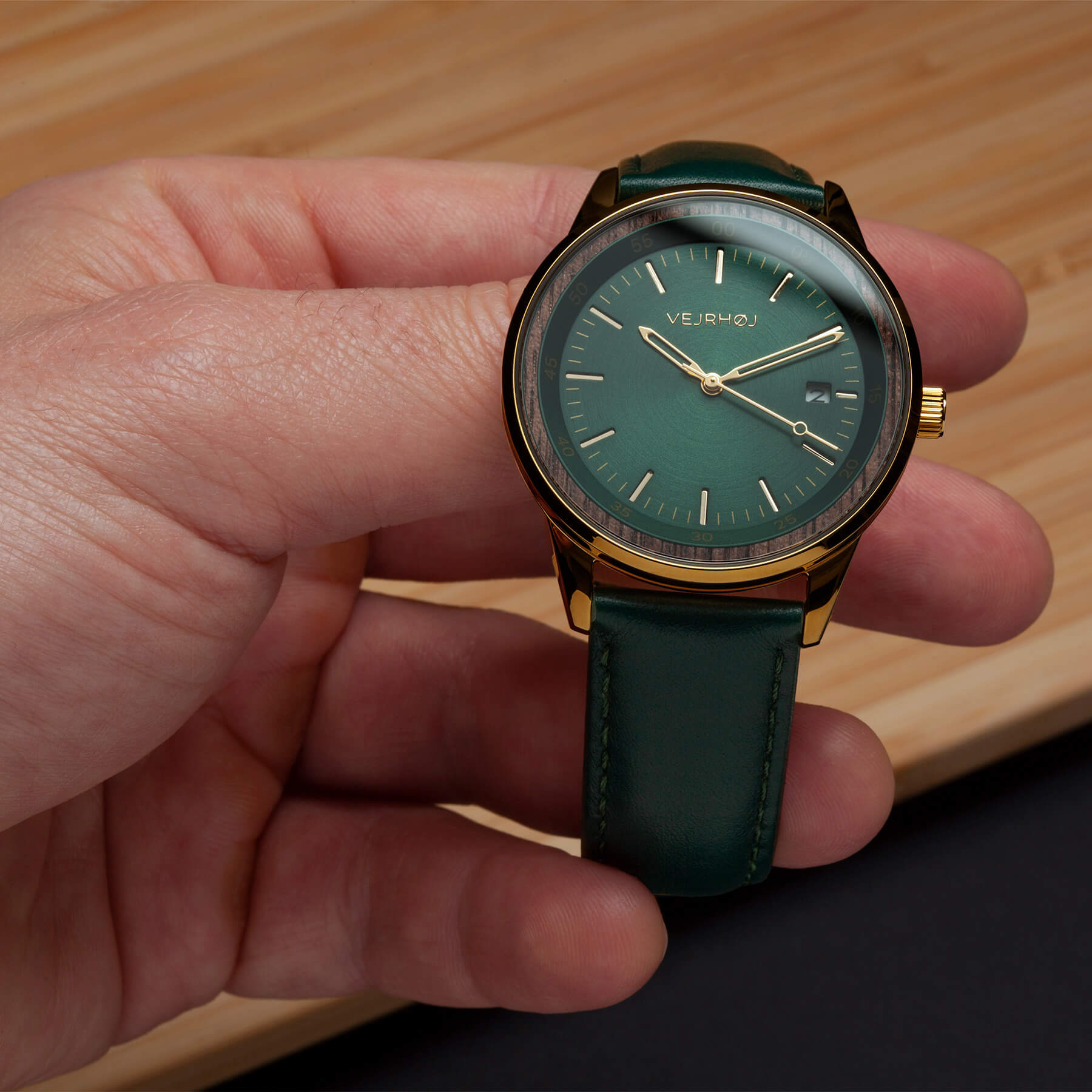 beautiful shot of the green automatic wrist watch model from the danish brand VEJRHØJ