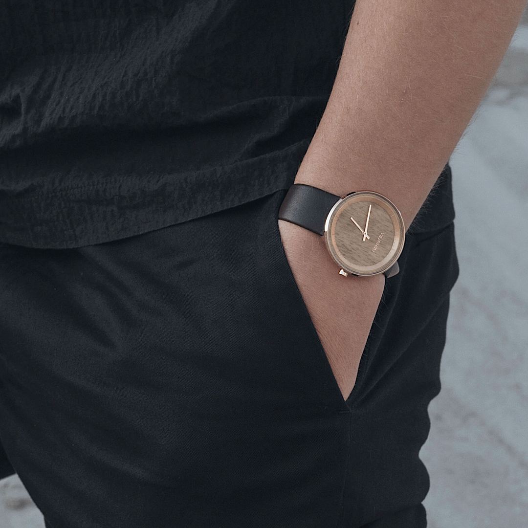 Men's rose gold watch on a wrist 